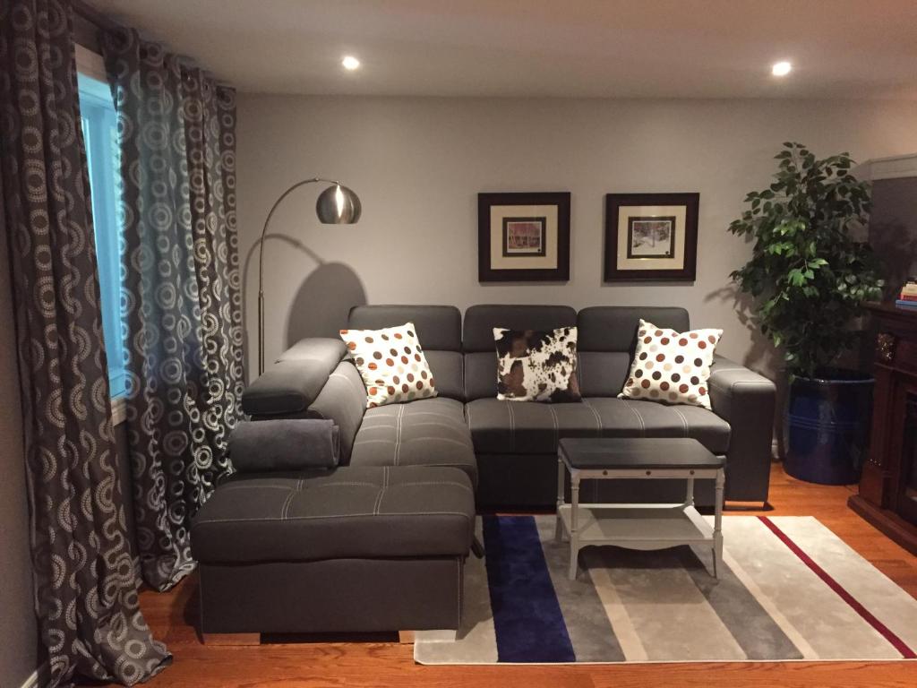 a living room with a couch and a table at Private Retreat in Dundas in Hamilton