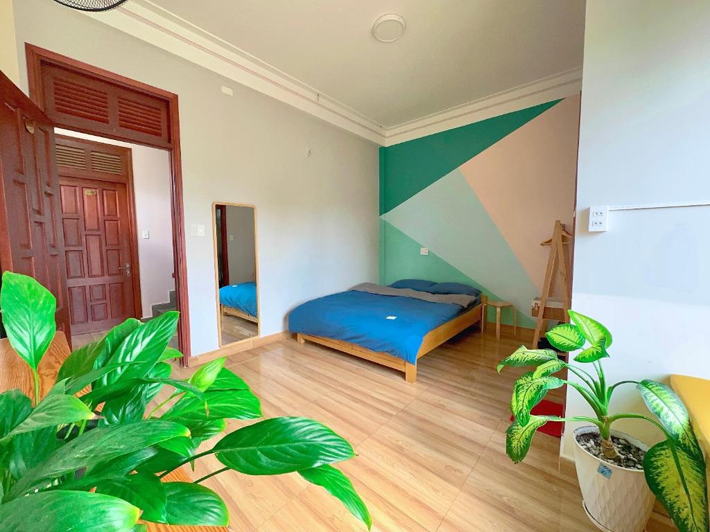 Una cama o camas en una habitación de Nấm Home