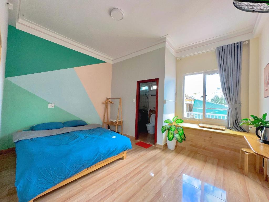 Una cama o camas en una habitación de Nấm Home