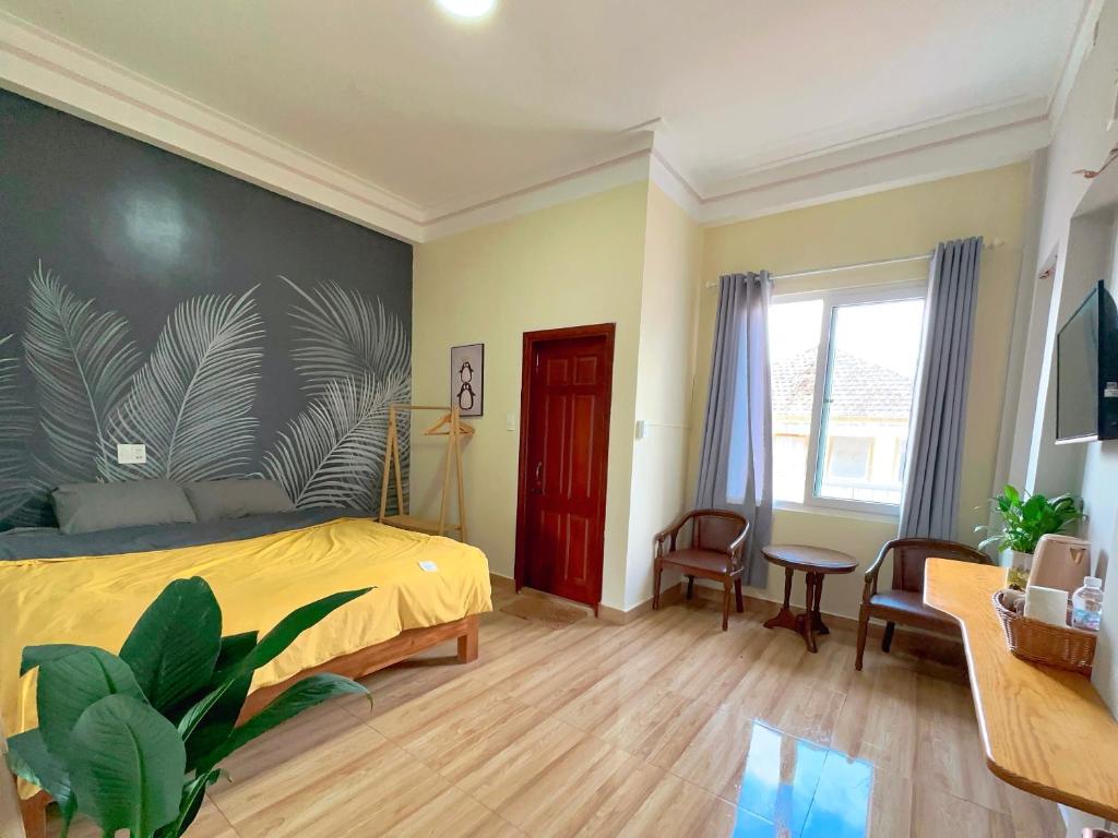Una cama o camas en una habitación de Nấm Home