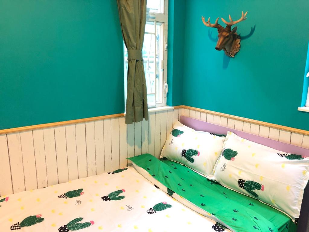 Postel nebo postele na pokoji v ubytování 香港名都商务旅馆 Ming Du Guesthouse