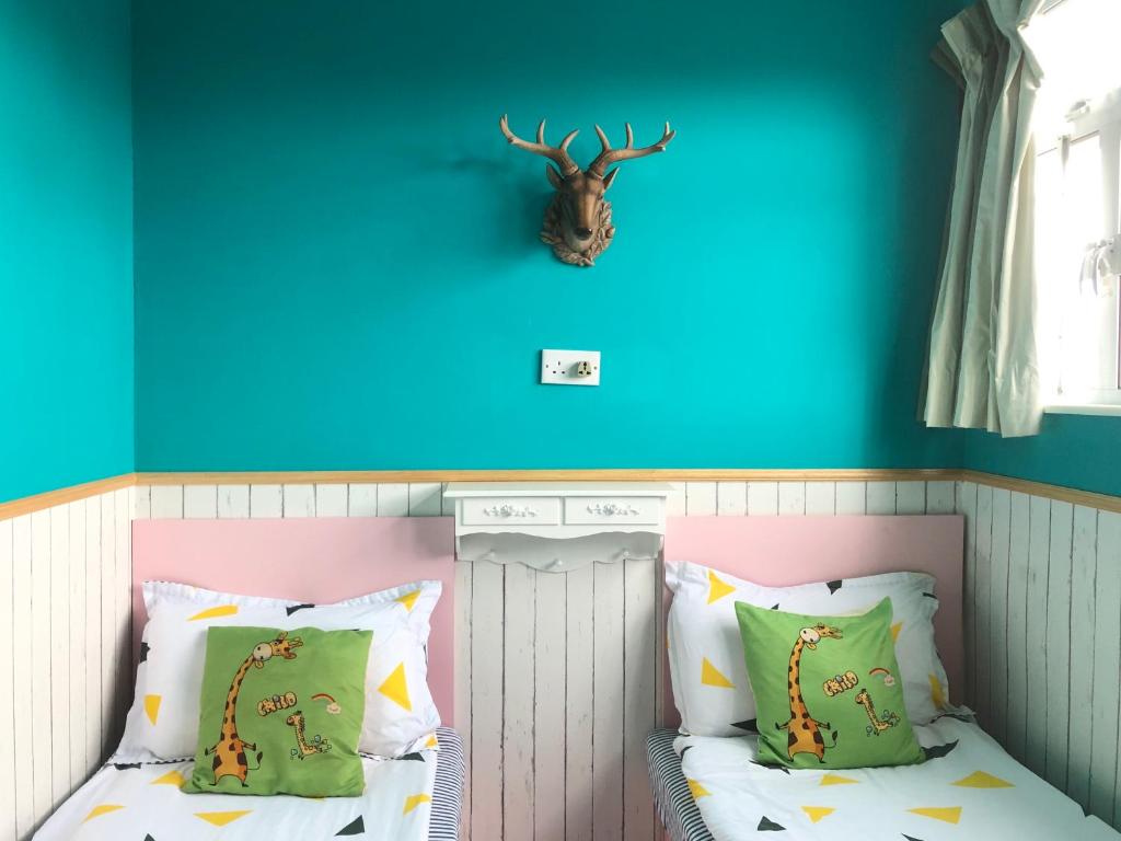 Postel nebo postele na pokoji v ubytování 香港名都商务旅馆 Ming Du Guesthouse