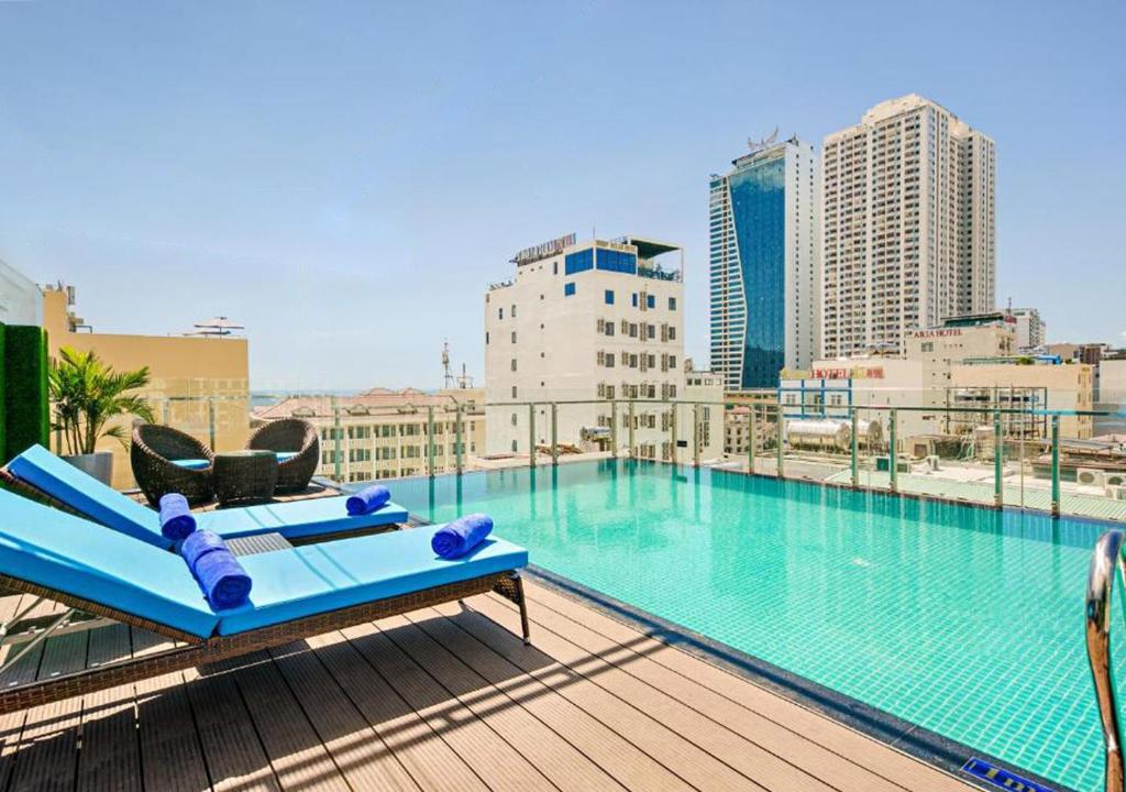 a large swimming pool on the roof of a building at Yuni Hotel And Apartment in Da Nang