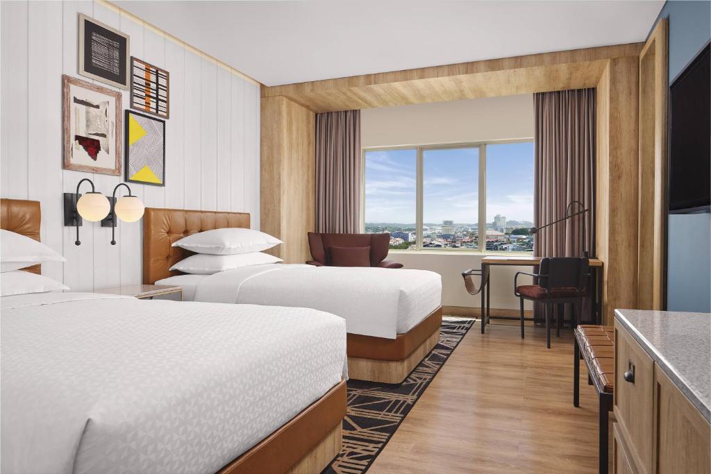 Una cama o camas en una habitación de Four Points by Sheraton Batam