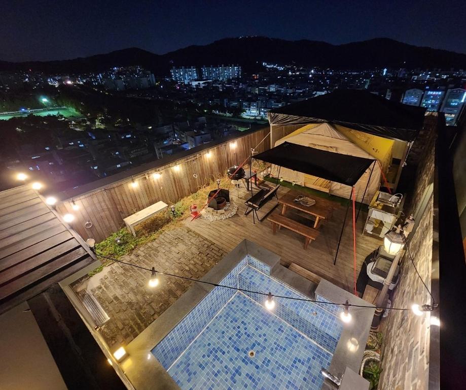 an overhead view of a tent on a building at night at Hotel 498 in Incheon