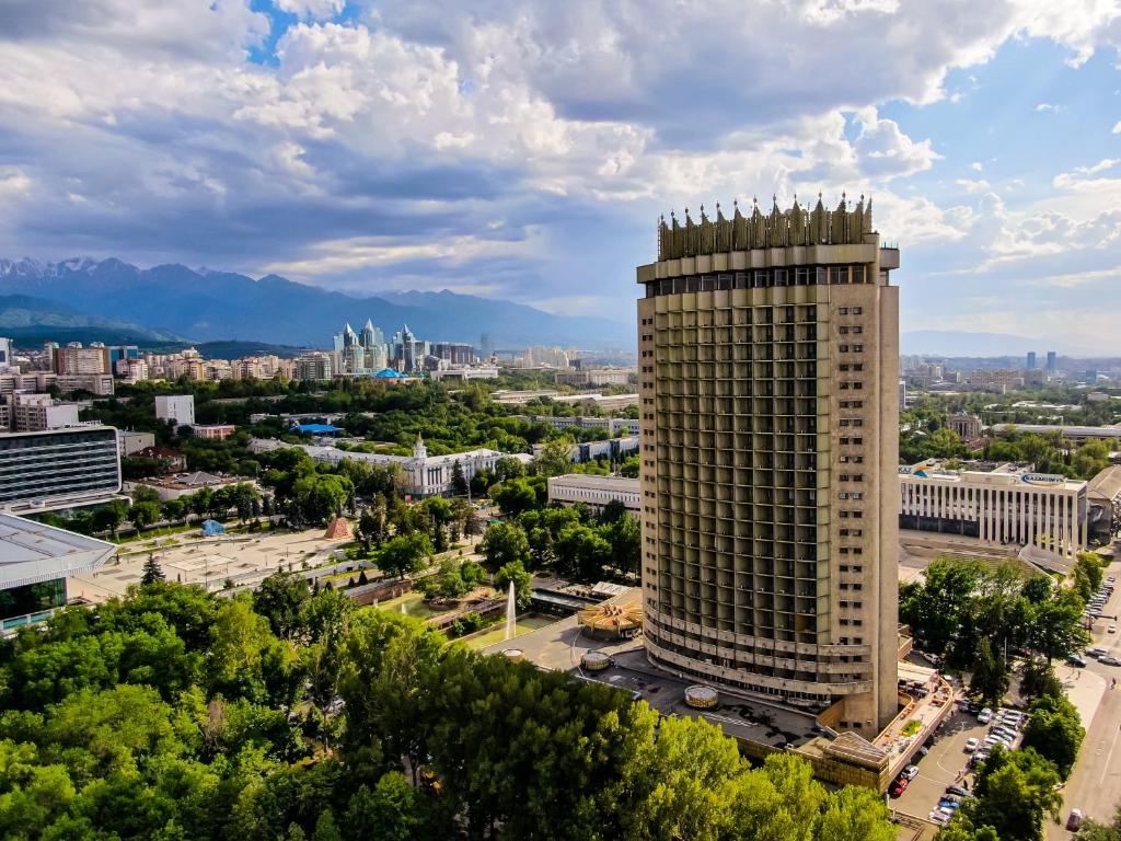 an aerial view of a city with a tall building at Kazakhstan Express in Almaty