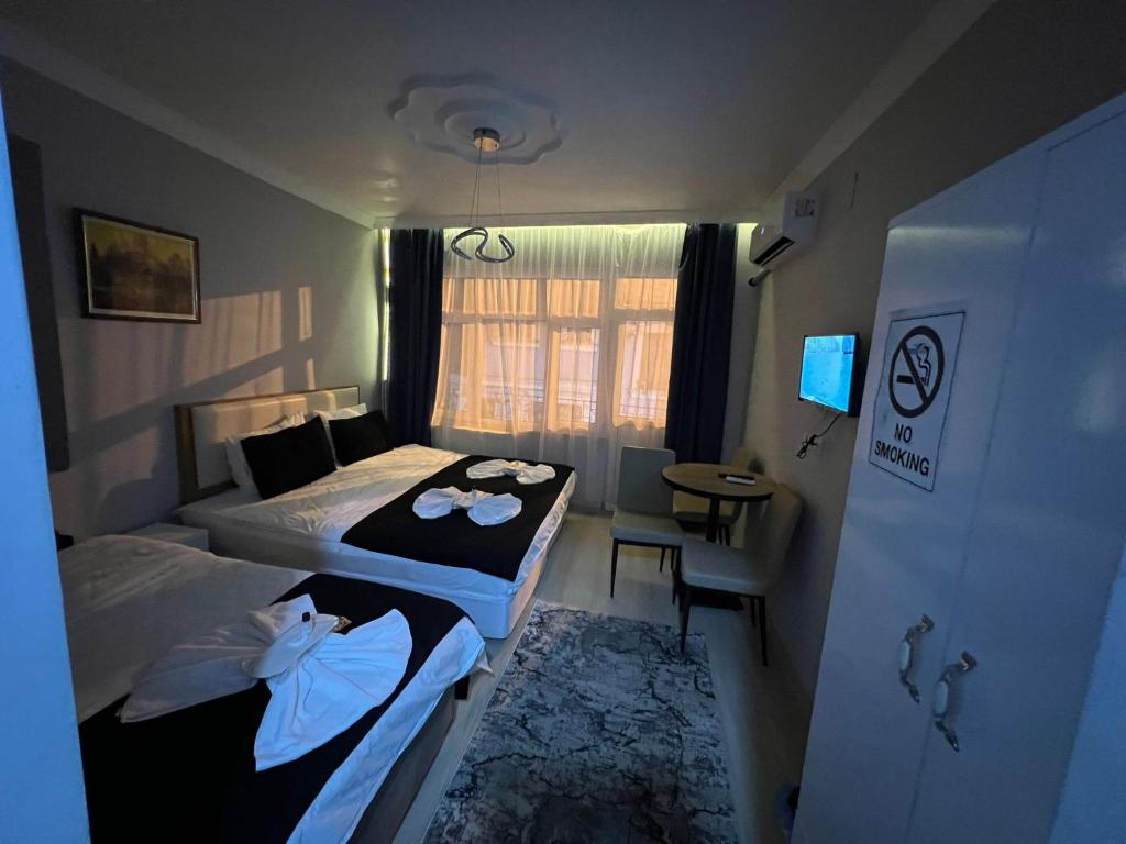 Postel nebo postele na pokoji v ubytování Taksim Millennium Suit Hotel