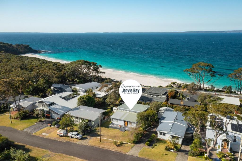 an aerial view of a house on the beach at Absolute Blue by Experience Jervis Bay in Hyams Beach