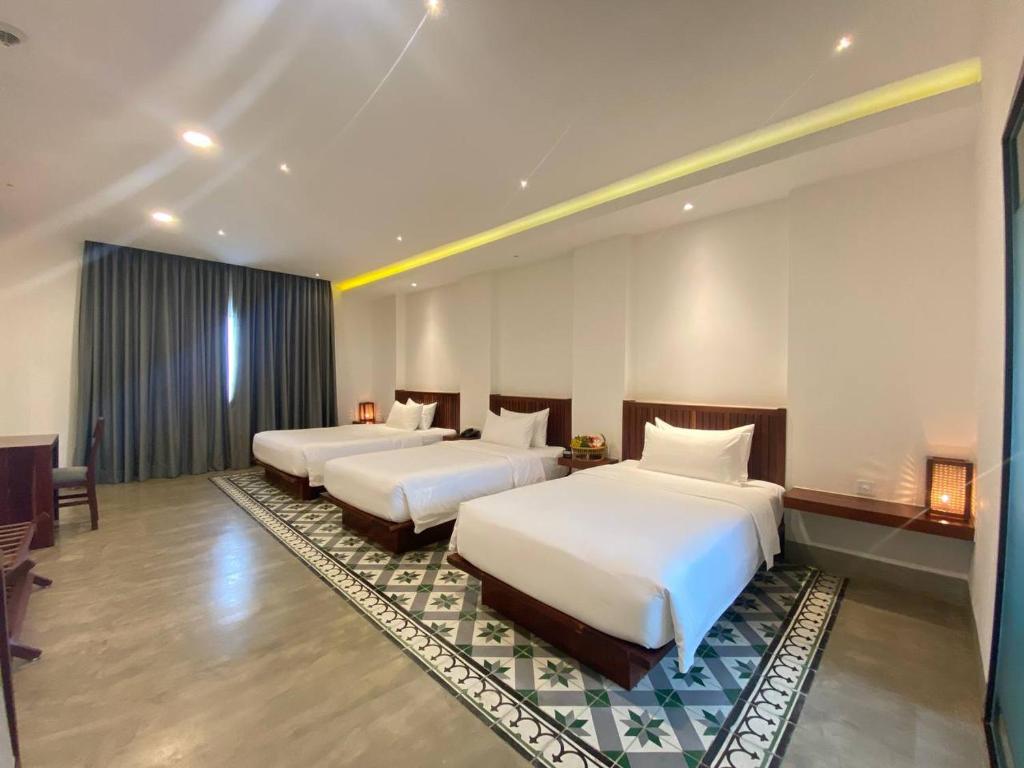 Postel nebo postele na pokoji v ubytování DACO Hotel