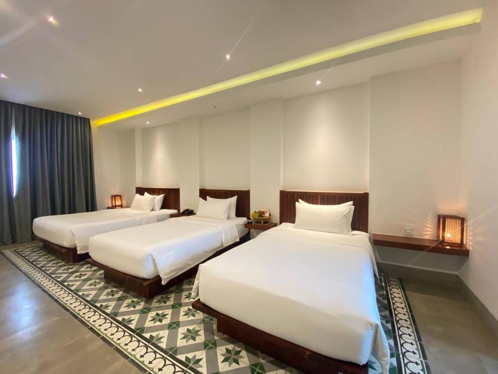 Postel nebo postele na pokoji v ubytování DACO Hotel