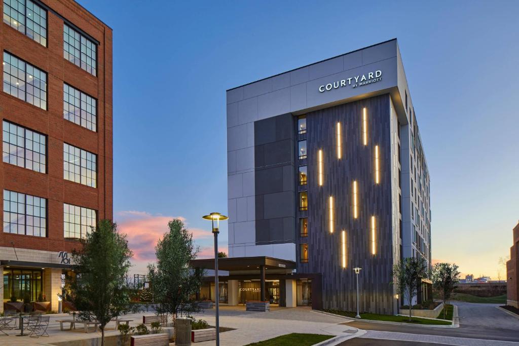 a rendering of the front of a building at Courtyard Baltimore Downtown/McHenry Row in Baltimore