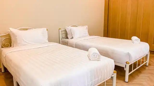 Postel nebo postele na pokoji v ubytování พูลวิลล่าชะอำ Amazia Pool Villa