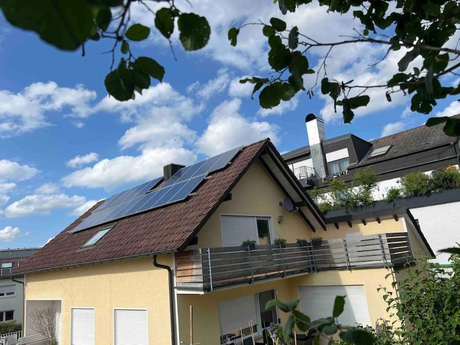 a house with solar panels on the roof at Gemütliche Stadtoase in Weingarten