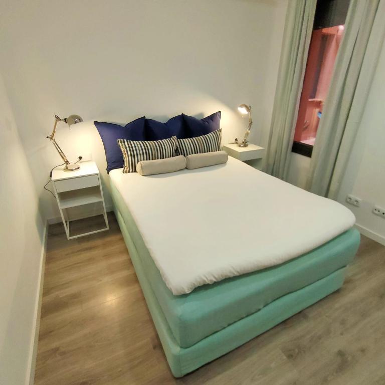 Postel nebo postele na pokoji v ubytování Mediterranean Barcelona Apartments