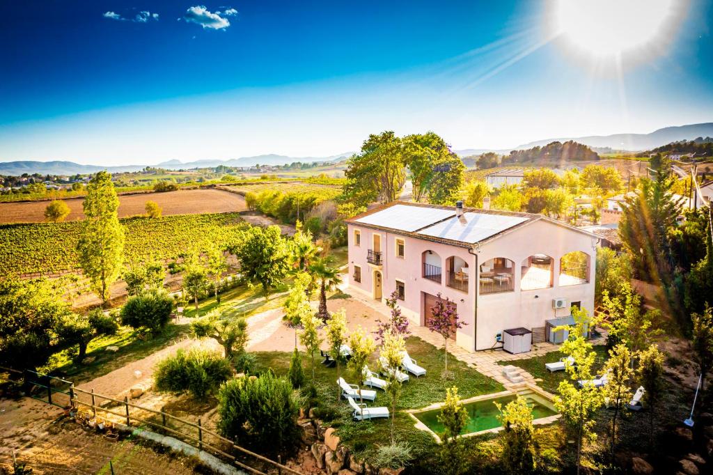 an aerial view of a house in a vineyard at Masia Cal Magi in Font-Rubí