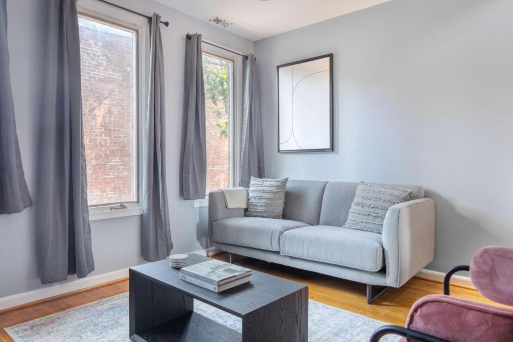 a living room with a couch and a table at Georgetown 2br w wd nr Embassy Row nightlife WDC-705 in Washington