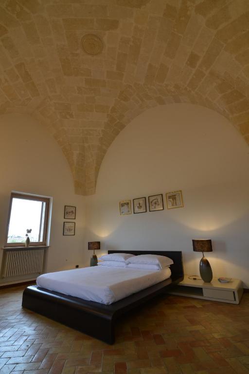 Postel nebo postele na pokoji v ubytování Antica Civita Luxury Room