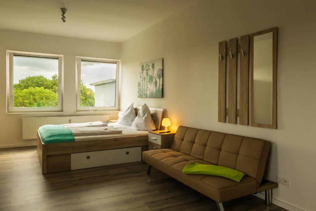 Кровать или кровати в номере City Apartments Wilhelmshaven