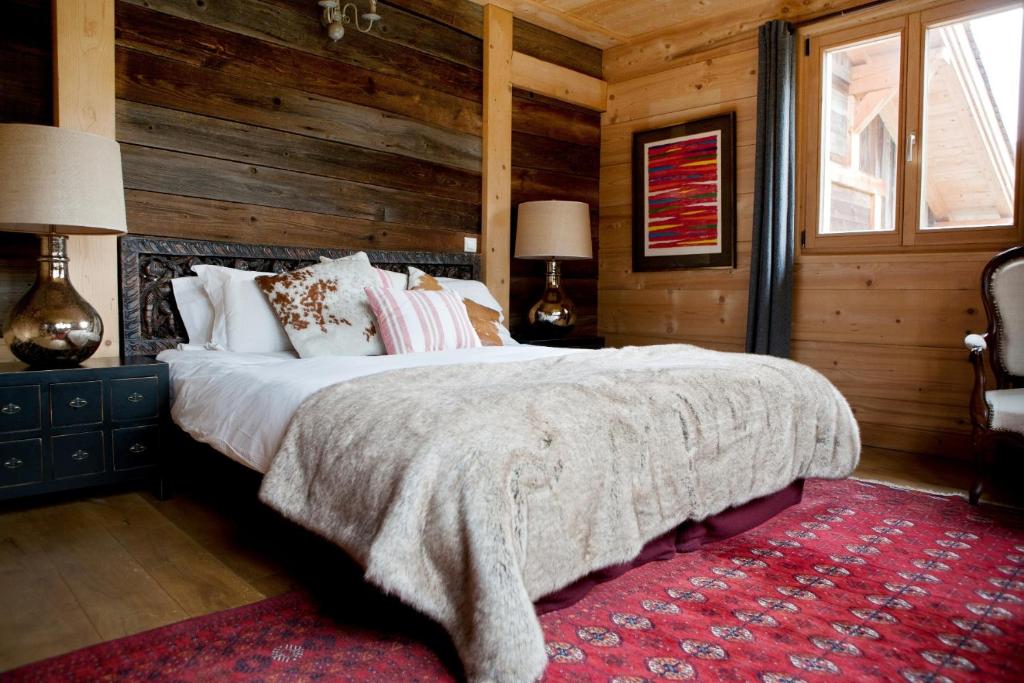 A bed or beds in a room at Chalet Amelie