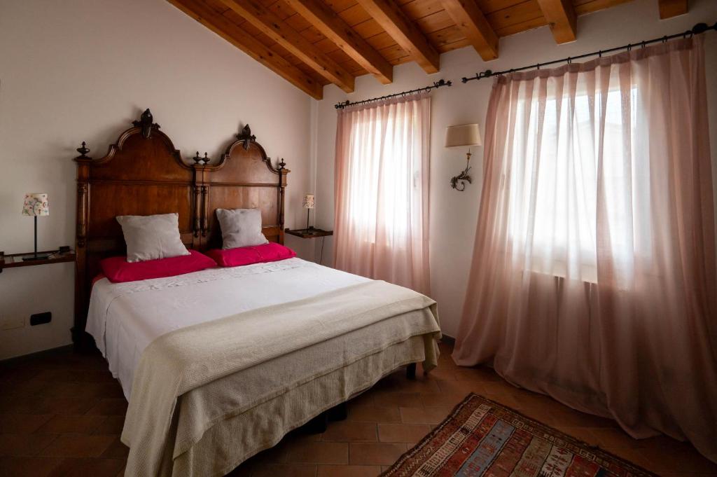 Postel nebo postele na pokoji v ubytování Agriturismo Terre Bianche