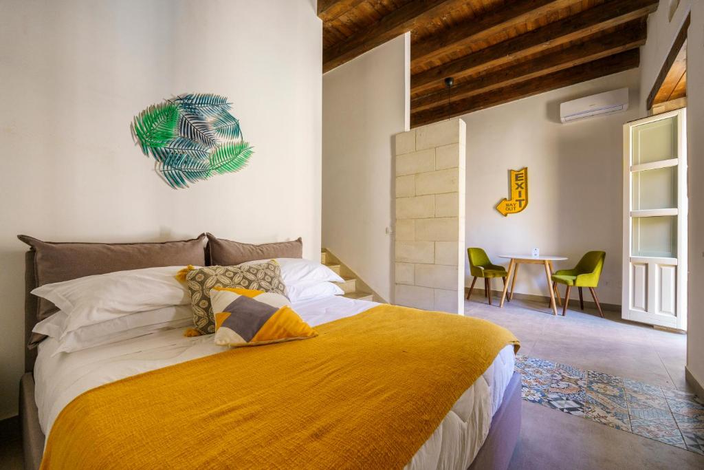 Posteľ alebo postele v izbe v ubytovaní Ortigia Boutique Palace