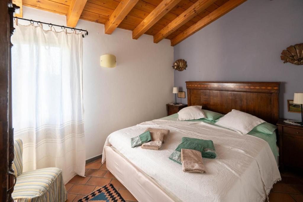 Postel nebo postele na pokoji v ubytování Agriturismo Terre Bianche