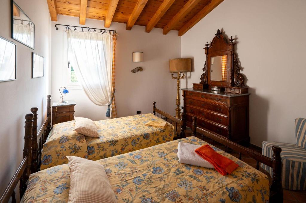 Postel nebo postele na pokoji v ubytování Agriturismo Terre Bianche