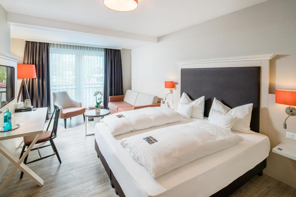 Postel nebo postele na pokoji v ubytování Flair Hotel Rieckmann