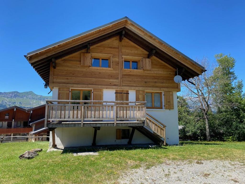 a house with a large deck on the side of it at Chalet Crest-Voland, 6 pièces, 8 personnes - FR-1-733-2 in Crest-Voland