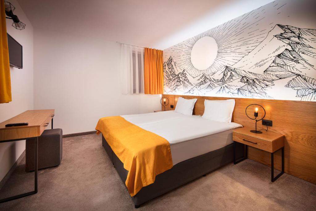 Postel nebo postele na pokoji v ubytování Hotel Alfaresort Thermal Chiflika