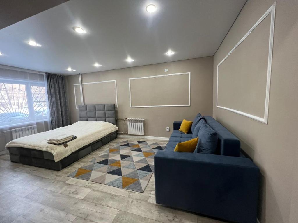 Postel nebo postele na pokoji v ubytování Квартира 1.5