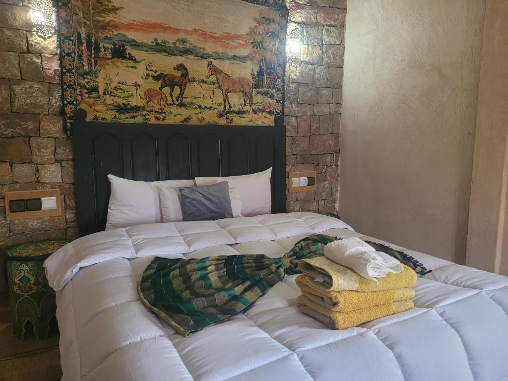 Voodi või voodid majutusasutuse Chambre d'hôtes aya toas