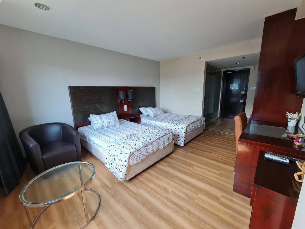 Postel nebo postele na pokoji v ubytování SUN GARDEN Studio and Residences at South China Sea Place Suites