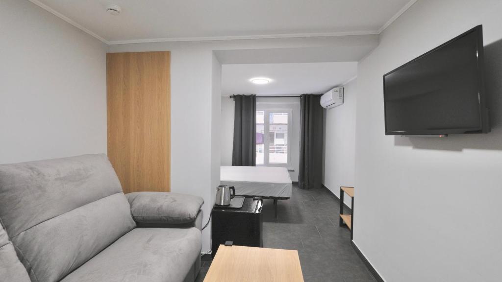 TV a/nebo společenská místnost v ubytování Hostal Lavela