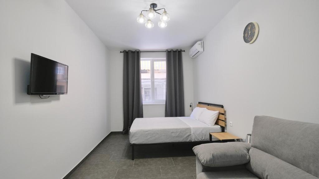 TV a/nebo společenská místnost v ubytování Hostal Lavela