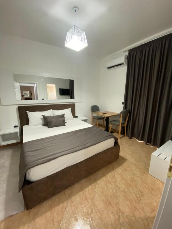 Ένα ή περισσότερα κρεβάτια σε δωμάτιο στο Monte Rei Hotel