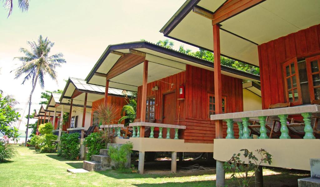 a row of cottages in a resort at Blue Lotus Resort in Ban Tai