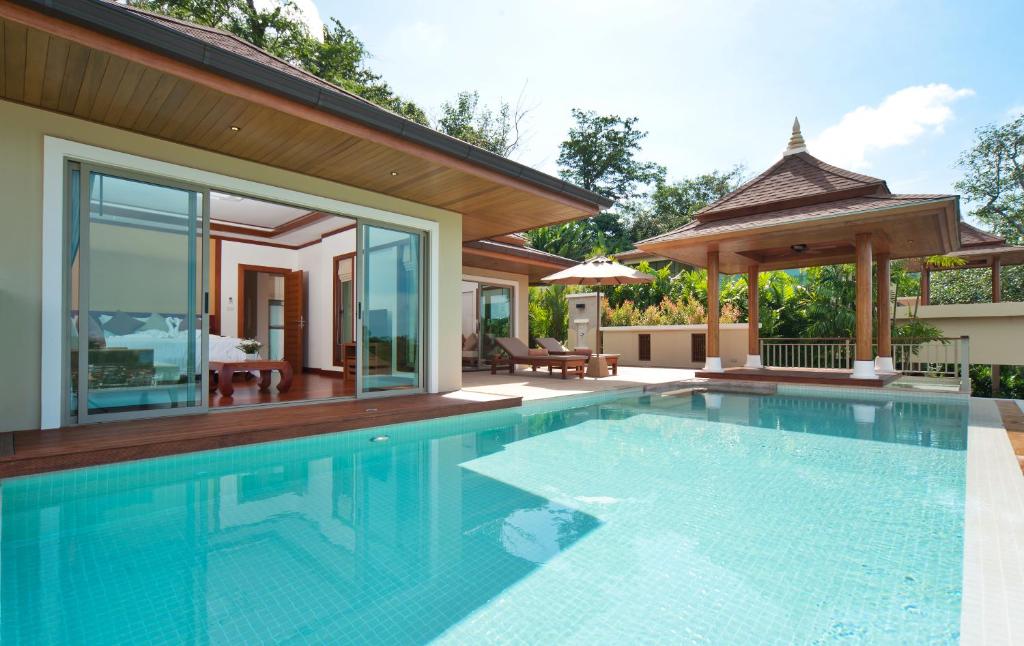 a swimming pool in a villa with a gazebo at Villa Tantawan Resort - Private Pool Villas in Kamala Beach