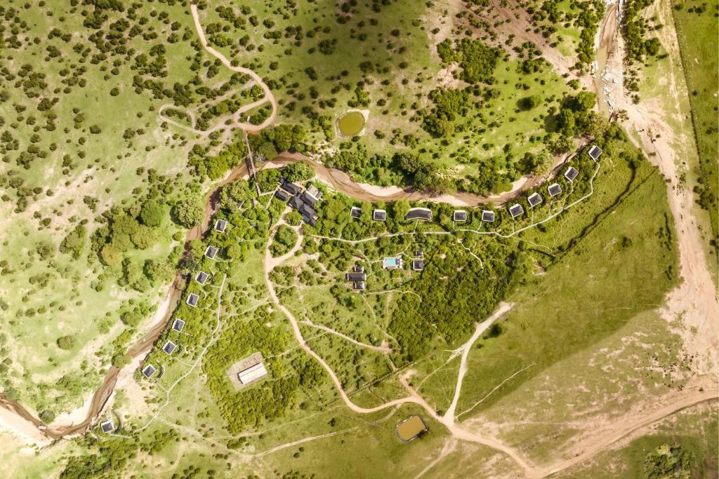 an overhead view of a park with houses and roads at JW Marriott Masai Mara Lodge in Masai Mara