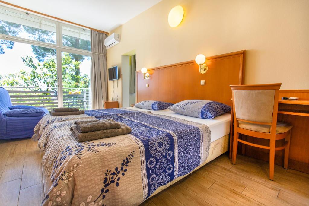 Postel nebo postele na pokoji v ubytování Maestral Residence