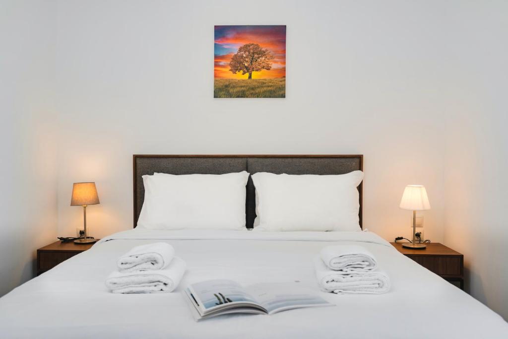 A bed or beds in a room at Kula apartments City center Exarchia