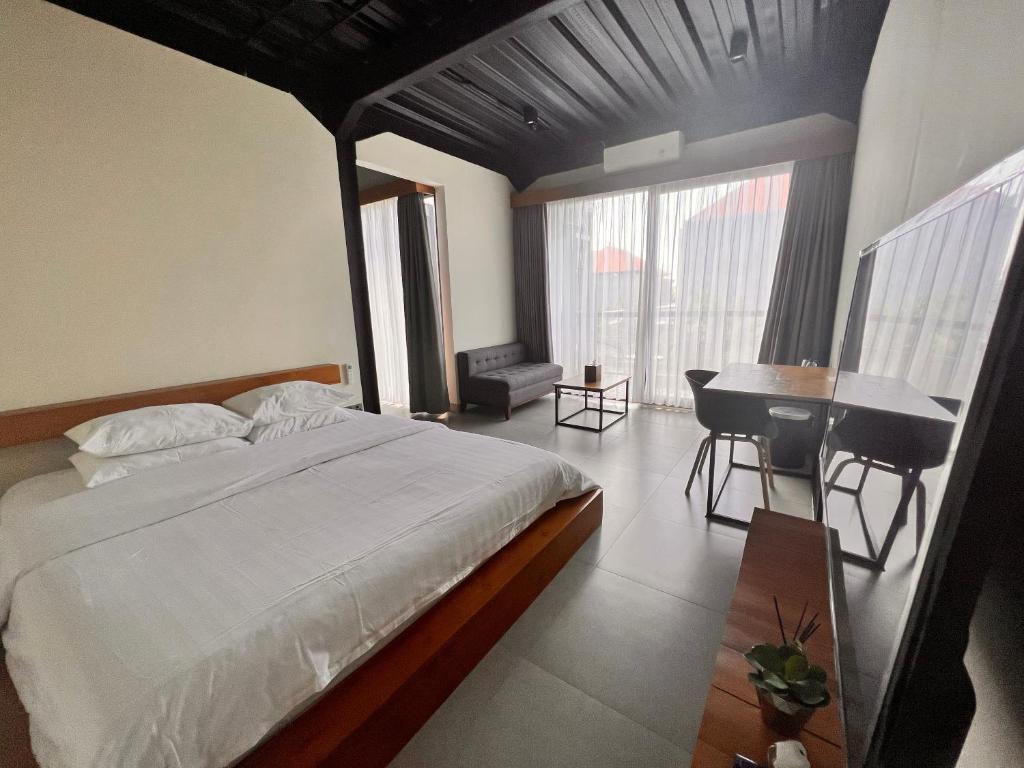 Postel nebo postele na pokoji v ubytování Rumah Kahyangan