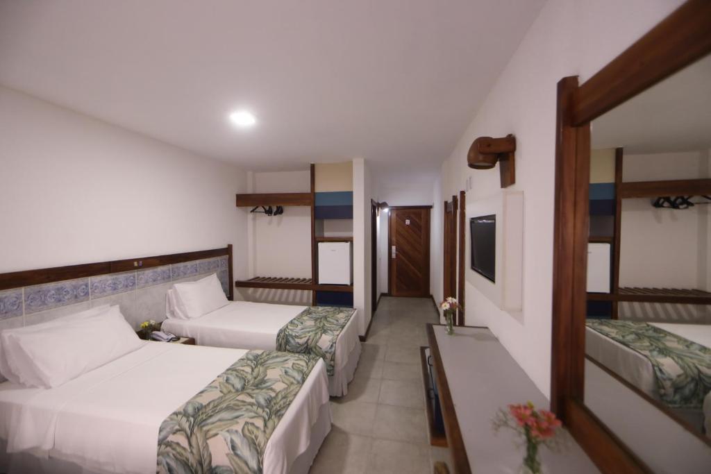 Postel nebo postele na pokoji v ubytování Opaba Praia Hotel