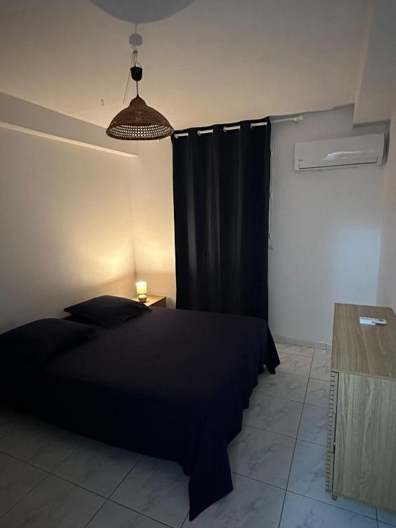 Postel nebo postele na pokoji v ubytování Chez Nouny