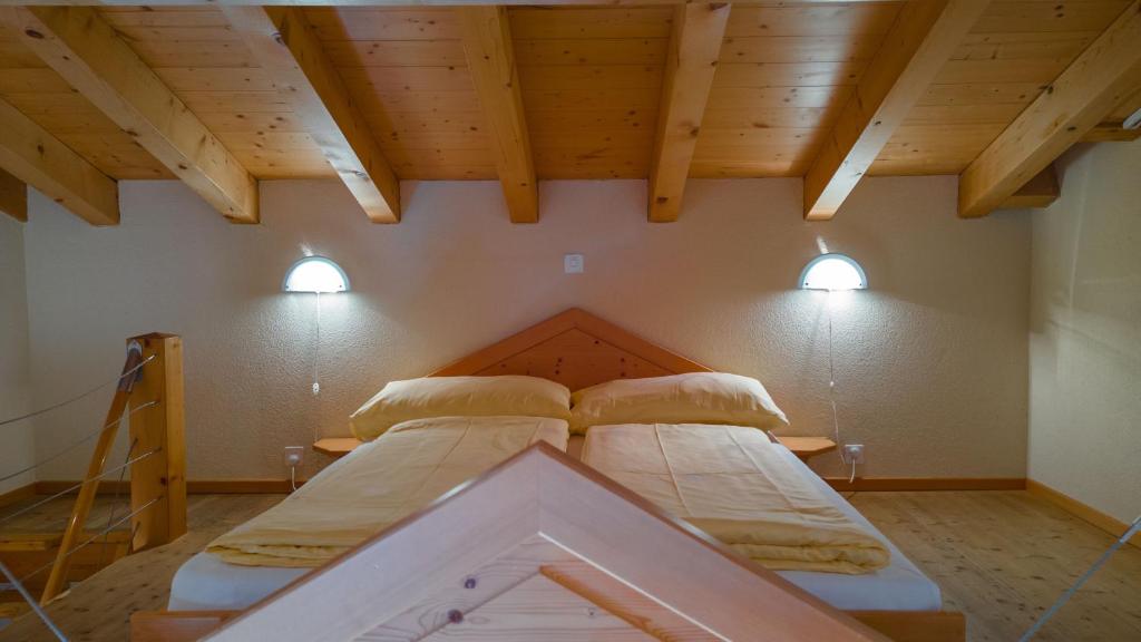 Cama o camas de una habitación en Hotel Central Wolter - Grindelwald