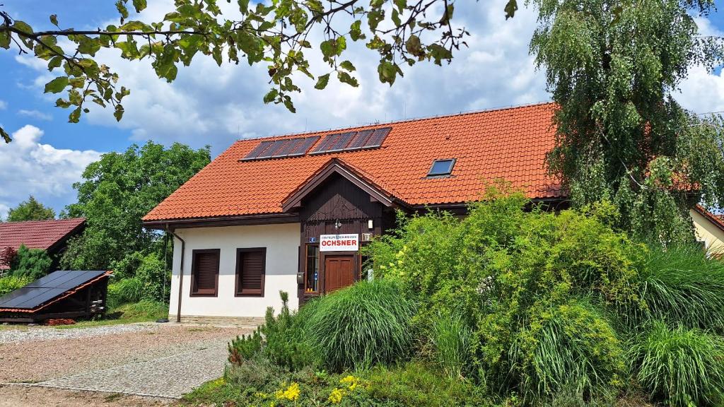 a building with solar panels on the roof at Eko Dom Eturia in Suchoraba