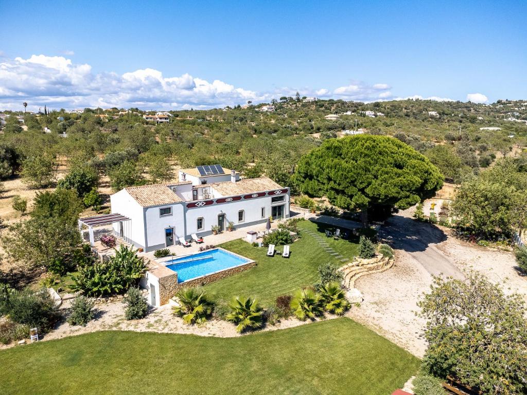 an aerial view of a house with a swimming pool at Villa Rodrigues in Boliqueime