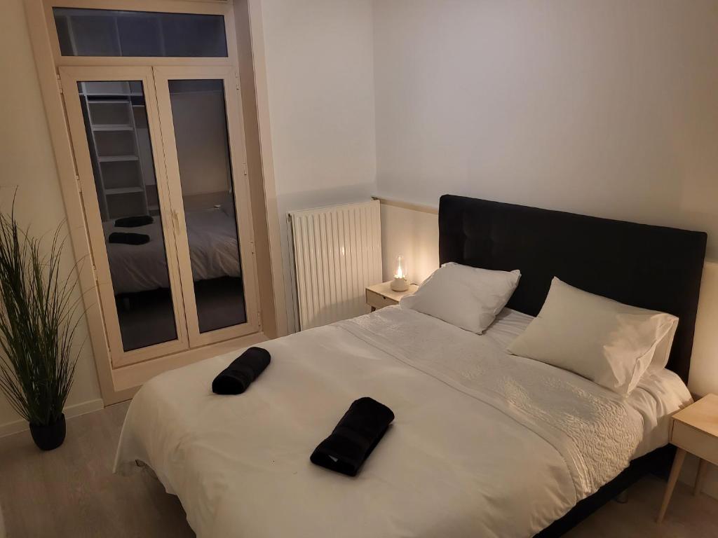 Postel nebo postele na pokoji v ubytování Huis ALNA 3