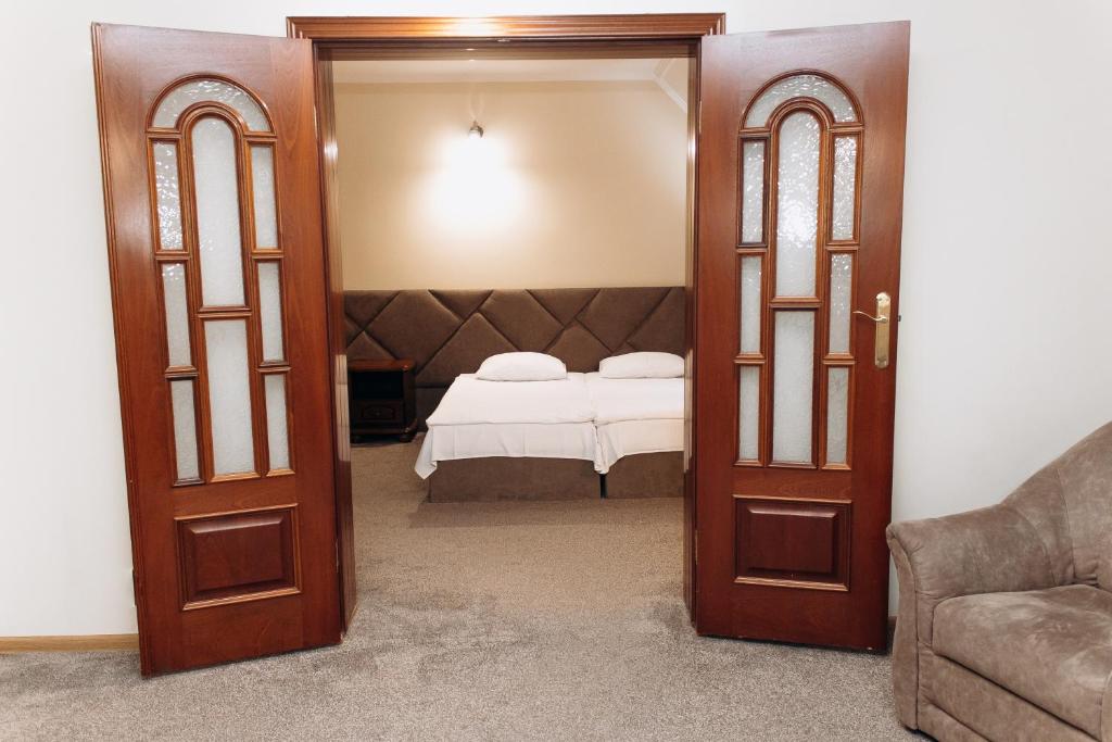Postel nebo postele na pokoji v ubytování Eduard Hotel