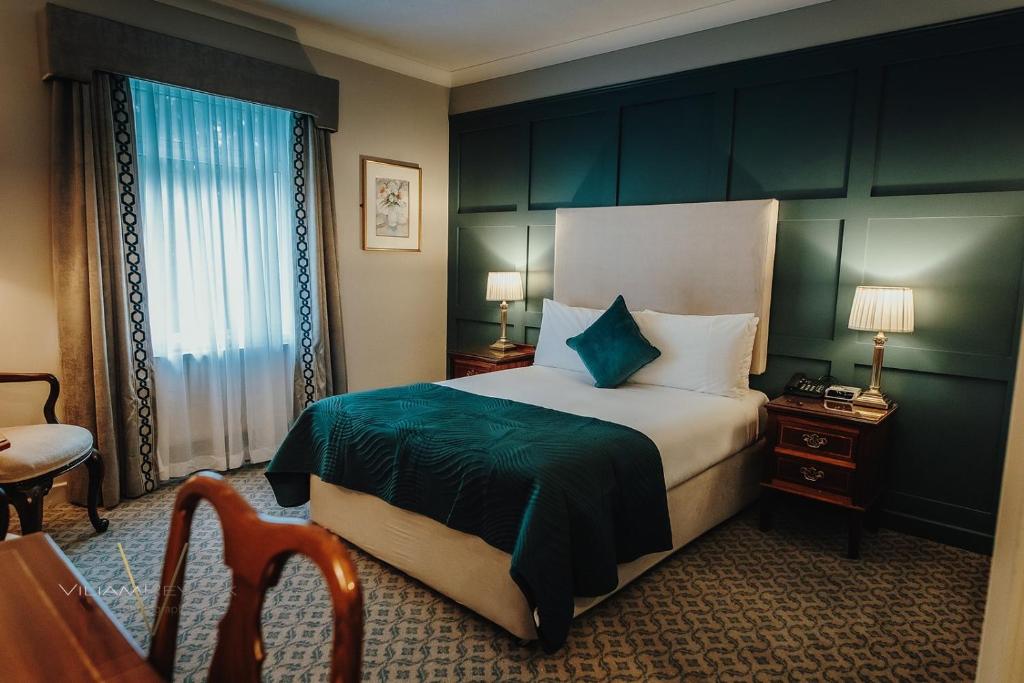 Postel nebo postele na pokoji v ubytování Abbey Hotel Roscommon